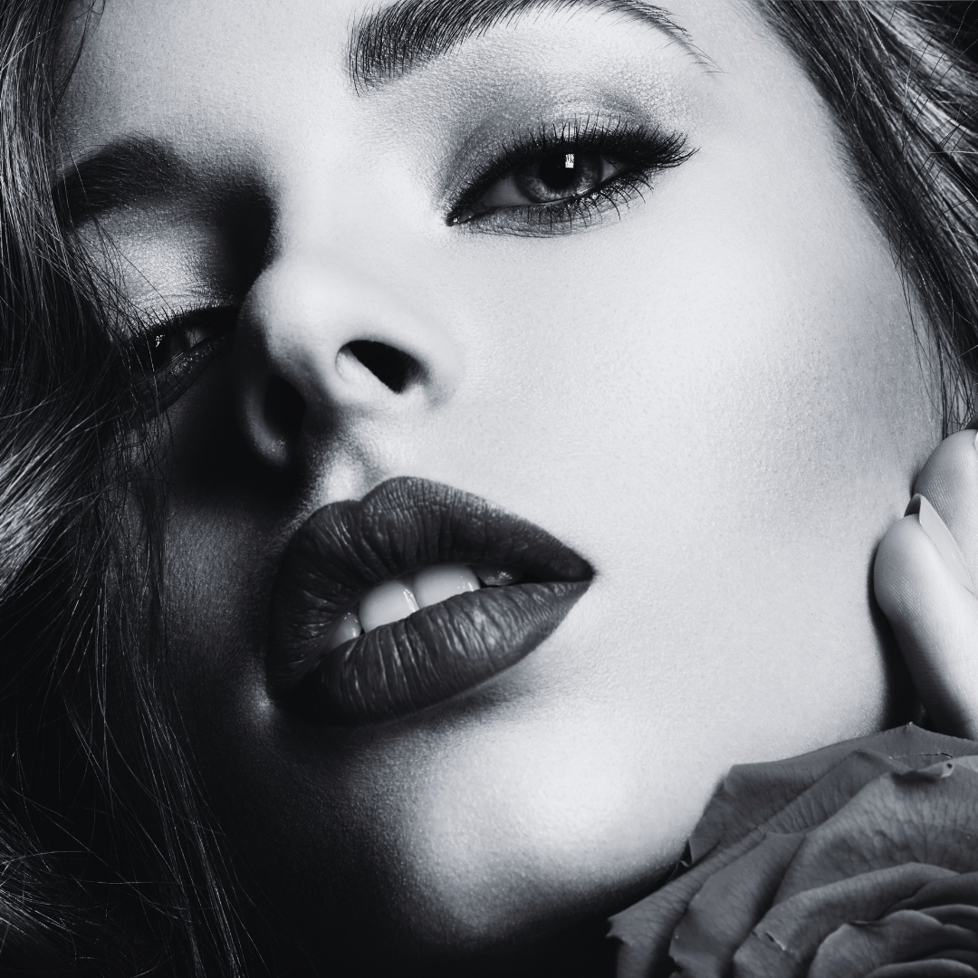 Black and white beauty close-up of a model with glamorous makeup by Nicole D.