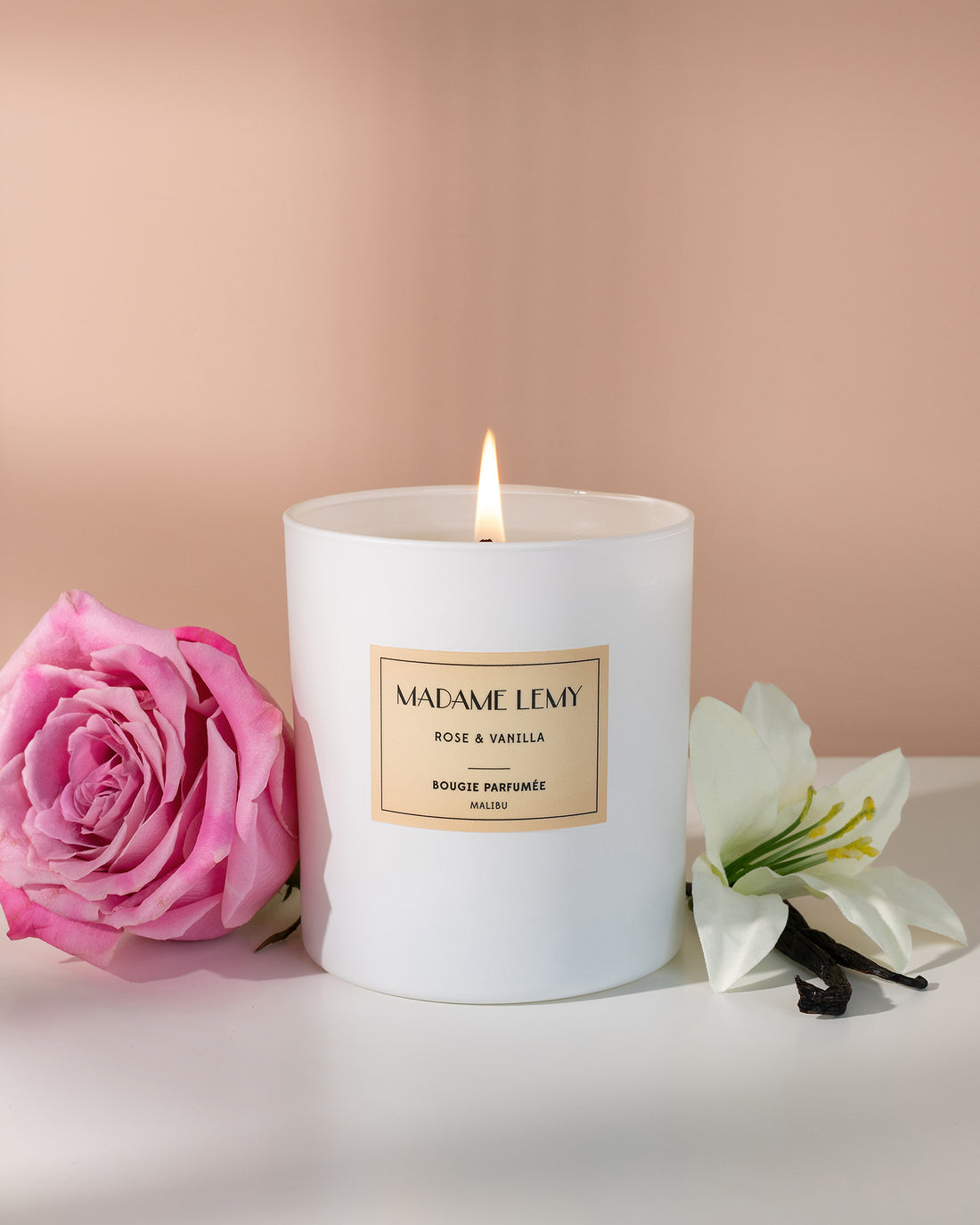 Scented candle with a pink rose, product photography by Melissa E.